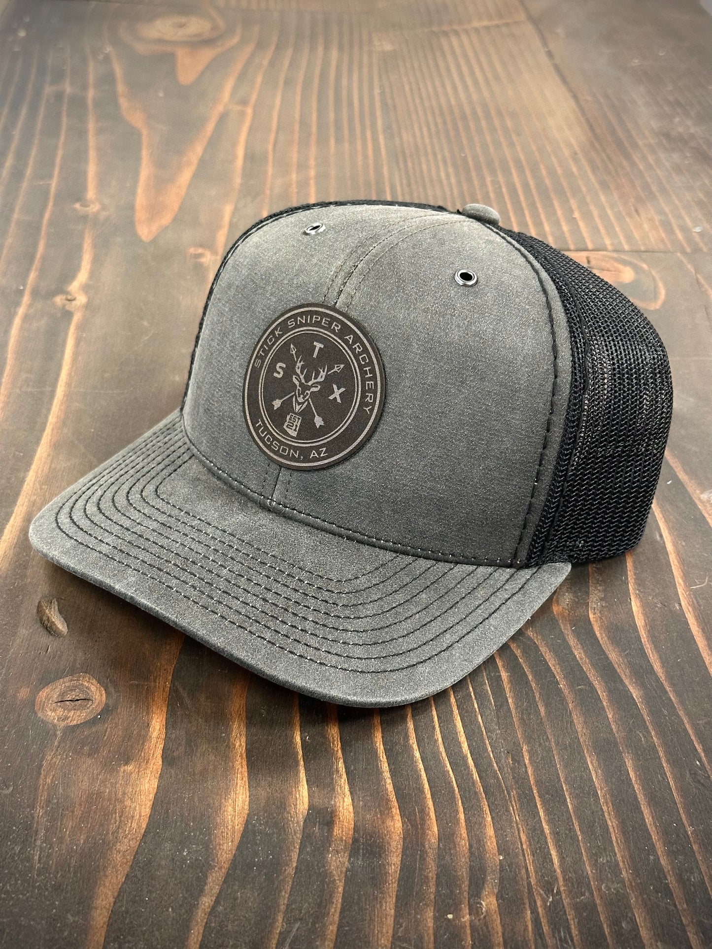 STK Charcoal/Black Trucker Hat - Leather Circle Deer Patch